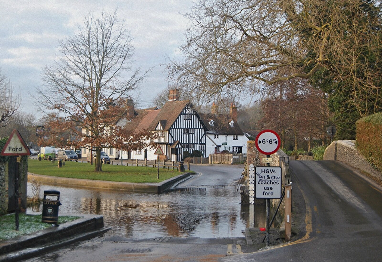 The ford across the River Darent at Eynsford, with the stone bridge alongside and a timber-framed building beyond